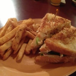 Tough Tymes Grille & Pub - February Burger with Fries - Cole Slaw and Onion Rings on hamburger and held together with Texas Toast (soon to be named)