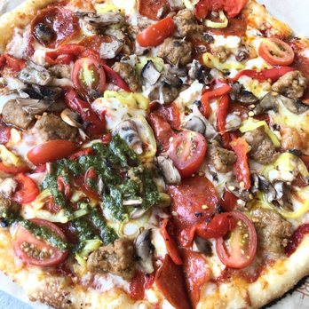 Blaze Pizza - Small pizza w/ pepperoni, sausage, feta, tomatoes, red peppers, banana peppers, and mushrooms. Topped with pesto on one slice! - Salad Near Me - Decatur, Georgia