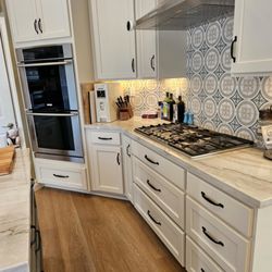 Pacific Kitchens Inc - Refaced with Maple in Sherwin Williams "Taupe of the Morning" and "Nightowl" colors.