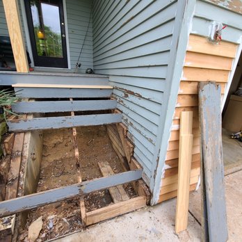 Byerly Painting Systems - a house with a hole in the side of the house - Painters Near Me - Cedar Rapids, Iowa Byerly Painting Systems - a house with a hole in the side of the house - Painters Near Me - Cedar Rapids, Iowa