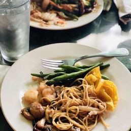 a plate of noodles and vegetables a plate of noodles and vegetables