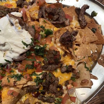 Saddle Ranch - Mound of Nachos w/ steak - Steakhouses Near Me - Orange, California Saddle Ranch - Mound of Nachos w/ steak - Steakhouses Near Me - Orange, California