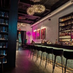 Harry's at Hofheimer - Book shelves, bar area, and front decor