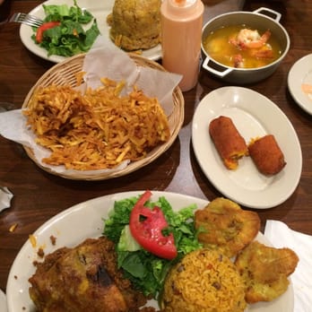 Isla Del Encanto - Pastelon de platano, arroz con gandules, tostones, alcapurrias de Jueyes, arañitas, mofongo, camarones al ajillo y mayo ketchup. - Puerto Rican Near Me - Miami, Florida Isla Del Encanto - Pastelon de platano, arroz con gandules, tostones, alcapurrias de Jueyes, arañitas, mofongo, camarones al ajillo y mayo ketchup. - Puerto Rican Near Me - Miami, Florida
