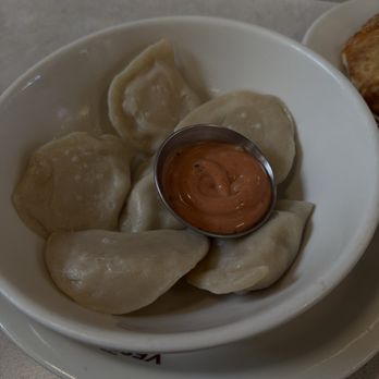 Veselka Williamsburg - Bacon, egg, and cheese boiled pierogies spicy ketchup - Desserts Near Me - Brooklyn, New York Veselka Williamsburg - Bacon, egg, and cheese boiled pierogies spicy ketchup - Desserts Near Me - Brooklyn, New York