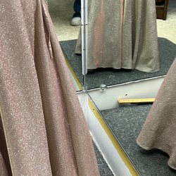 Alma's Alterations - You can see in the mirror that it is 2 inches off the floor in one place, and dragging the ground in another ..... with flats.
