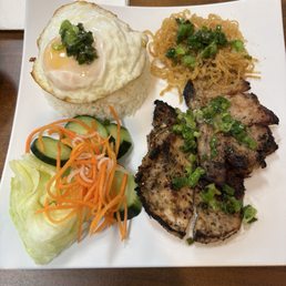 house special rice plate. pork chops, rice with egg.