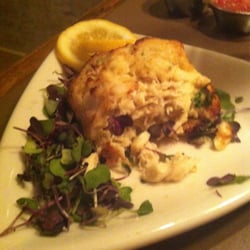 Center Square Brewing - Half eaten crab cake on a bed of water crest. Very good