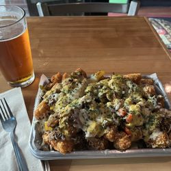 Bella's Sports Pub - Sierra Nevada on Draft & Fiesta Tots. Super yummy & generous great portion!