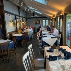 Martine's RiverHouse Restaurant - Interior dining room facing the river