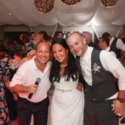 Coastal DJ & Video Outer Banks - Owner/DJ George Wainwright with a happy couple during a wedding reception in Corolla, NC
