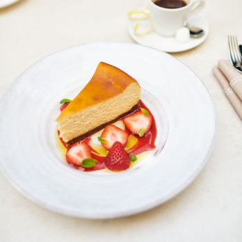 L'Ermitage - piece of cheesecake and strawberries - French Near Me - Beverly Hills, California L'Ermitage - piece of cheesecake and strawberries - French Near Me - Beverly Hills, California