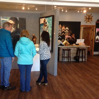 Emanate Gallery - Gallery-goers perusing our wall of oil paintings - Art Galleries Near Me - South Lake Tahoe, California Emanate Gallery - Gallery-goers perusing our wall of oil paintings - Art Galleries Near Me - South Lake Tahoe, California