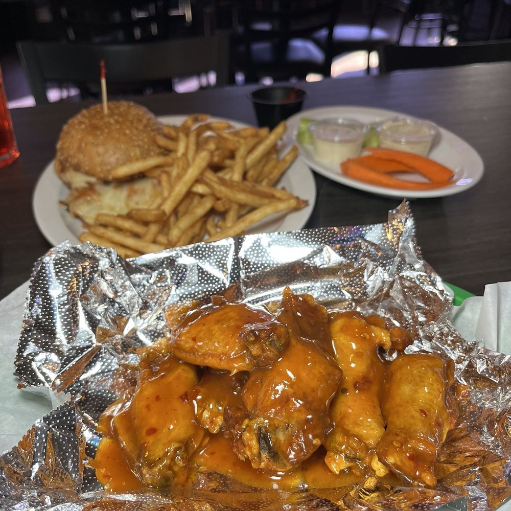 Charleys Place - Close up of the crispy and saucy habanero wings! - American Near Me - Glendale, Arizona