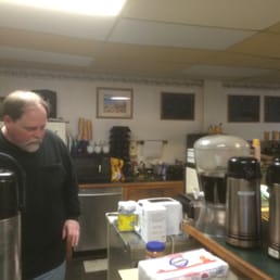 a man standing in a coffee shop