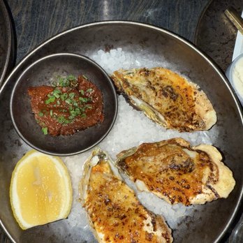Dōgon - Charbroiled Oysters* Croatian Butter, Parmigiano, Red Stew - Caribbean Near Me - Washington, DC, District of Columbia Dōgon - Charbroiled Oysters* Croatian Butter, Parmigiano, Red Stew - Caribbean Near Me - Washington, DC, District of Columbia