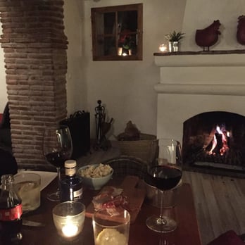 Arco Tapas Bar - Enjoying some wine and tapas next to the cozy fireplace. - Tapas Bars Near Me - Marbella, Massachusetts