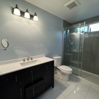Coach Construction - New floors, vanity and light fixture - General Contractors Near Me