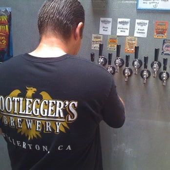 Bootlegger's Brewery - Aaron filling a growler - Breweries Near Me - Fullerton, California Bootlegger's Brewery - Aaron filling a growler - Breweries Near Me - Fullerton, California