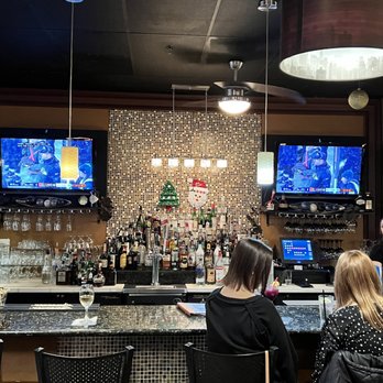 Fuso Italian Restaurant - a group of people sitting at a bar - Italian Near Me - Vacaville, California Fuso Italian Restaurant - a group of people sitting at a bar - Italian Near Me - Vacaville, California