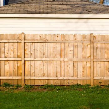 Luis's Gardening Services - a wooden fence in front of a house - Gardeners Near Me Luis's Gardening Services - a wooden fence in front of a house - Gardeners Near Me