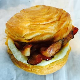 Double bacon, cheddar and egg croissant breakfast sandwich Double bacon, cheddar and egg croissant breakfast sandwich