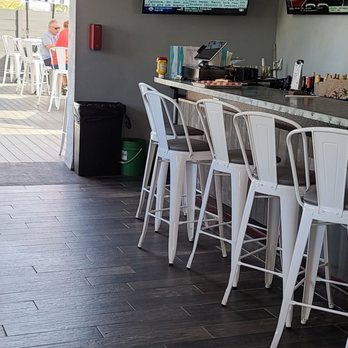 Hogan's Hangout - Mustard and ketchup made it to the end of the bar. - Sports Bars Near Me - Clearwater, Florida