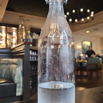 Inman Social - a bottle of water on a tray - Italian Near Me - Cleveland, Tennessee Inman Social - a bottle of water on a tray - Italian Near Me - Cleveland, Tennessee