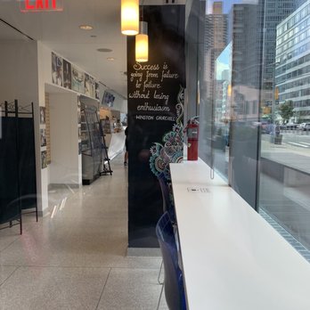Li'l Jay's - a long white table with a blue chair - Cafes Near Me - New York, New York Li'l Jay's - a long white table with a blue chair - Cafes Near Me - New York, New York