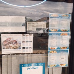 Hunter's Pizza - Menus and articles in front window
