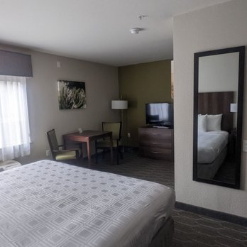 Best Western North Phoenix Hotel - Bed looking at tv and seating table area - Hotels Near Me - Phoenix, Arizona Best Western North Phoenix Hotel - Bed looking at tv and seating table area - Hotels Near Me - Phoenix, Arizona