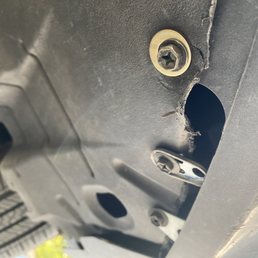 Repaired engine splash guard