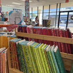 Not Your Mama's Quilt Store - Lots of colorful quilting fabrics beautifully displayed.