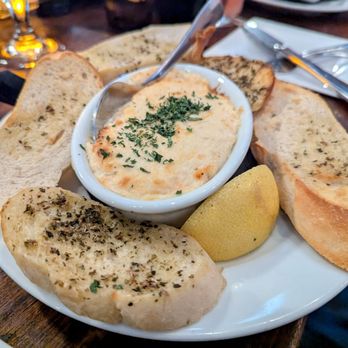 Greg Norman Australian Grille - Hot Crab Dip: Atlantic coast blue crab, served with toast points "Hot" because of its temperature, it's not spicy - Seafood Near Me - North Myrtle Beach, South Carolina Greg Norman Australian Grille - Hot Crab Dip: Atlantic coast blue crab, served with toast points "Hot" because of its temperature, it's not spicy - Seafood Near Me - North Myrtle Beach, South Carolina