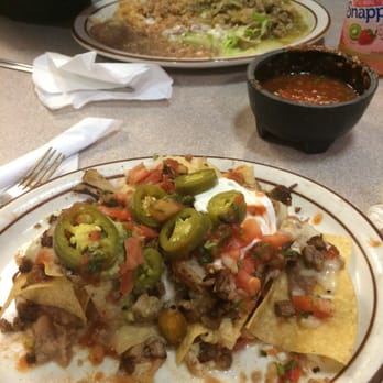 El Taco Grande - This a photo of the Carnitas Super Nachos and across is the Chili Verde. Both soooo GOOD !!! - Mexican Near Me - Carpinteria, California El Taco Grande - This a photo of the Carnitas Super Nachos and across is the Chili Verde. Both soooo GOOD !!! - Mexican Near Me - Carpinteria, California