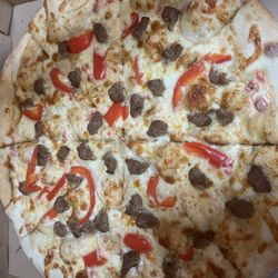 Nicky Knots Street Pizza - Alfredo pizza with sausage and red pepper.