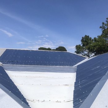 Adventure Construction Contractors - a view of a roof with solar panels - General Contractors Near Me - Youngstown, Florida