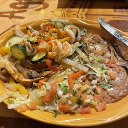 Grilled chicken, shrimp & veggies with flour tortillas. Substituted refried beans for the rice.