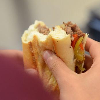 Nicky's Phillys Cheesesteak - a hand holding a sandwich - Caterers Near Me - Norco, California Nicky's Phillys Cheesesteak - a hand holding a sandwich - Caterers Near Me - Norco, California