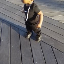 Baby boy looking at the waterfront