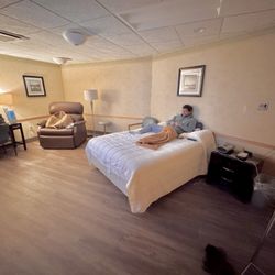 UHS Sleep & Neurodiagnostic Center - Full size bed, extra wide recliner, desk with chair and side table