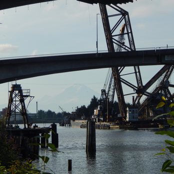 Spokane Street Bridge - Mount Rainier barely visible under the Spokane Street Bridge from Terminal 18 Park. - Landmarks & Historical Buildings Near Me - Seattle, Washington Spokane Street Bridge - Mount Rainier barely visible under the Spokane Street Bridge from Terminal 18 Park. - Landmarks & Historical Buildings Near Me - Seattle, Washington