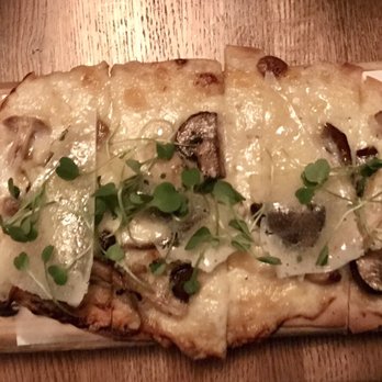 Amada - Spanish flatbreads - artichoke, wild mushrooms, black truffles, topped with manchego cheese - Tapas Bars Near Me - Philadelphia, Pennsylvania Amada - Spanish flatbreads - artichoke, wild mushrooms, black truffles, topped with manchego cheese - Tapas Bars Near Me - Philadelphia, Pennsylvania