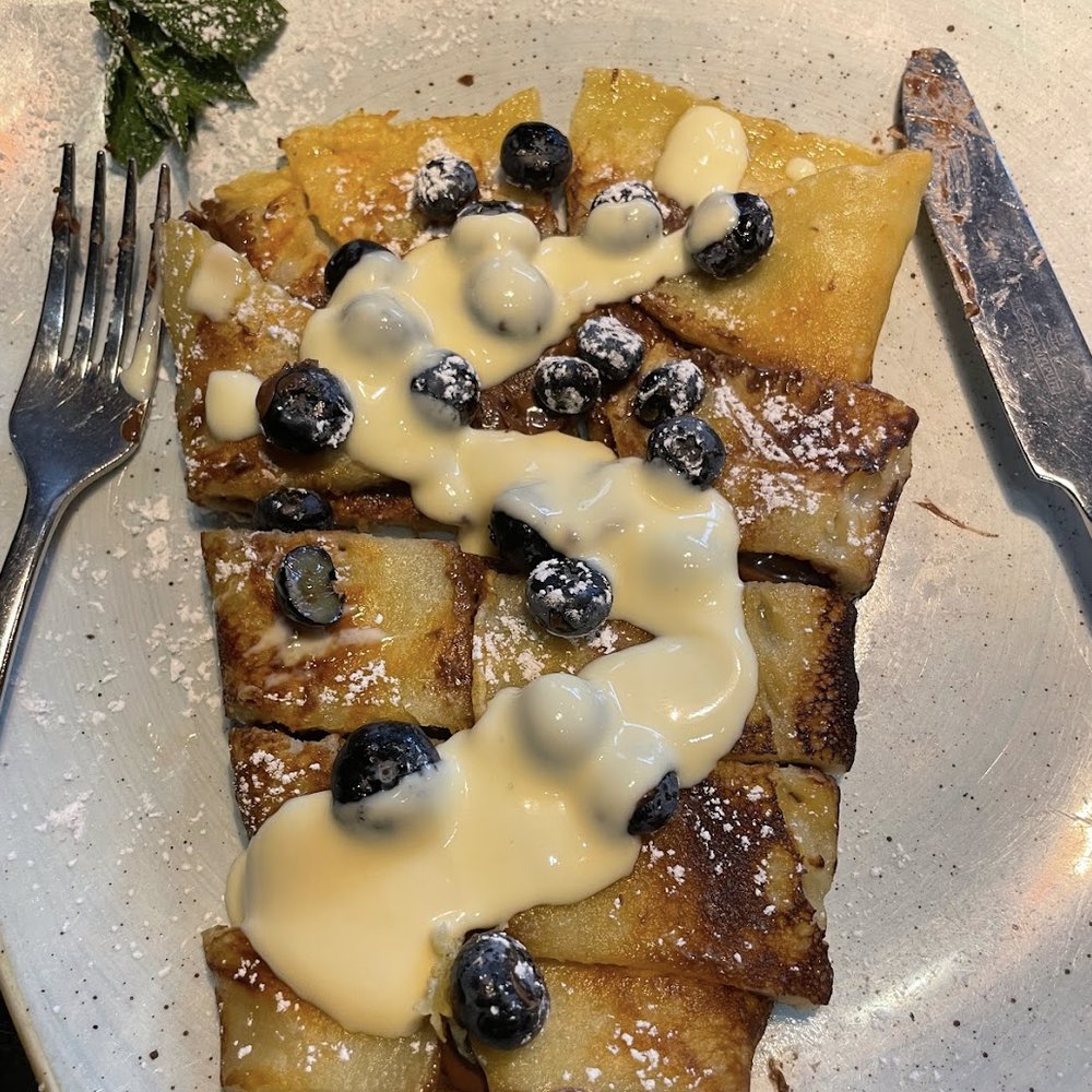 Du & Ich - Blueberry crepe with vanilla sauce drizzled on top. - Cafes Near Me - Wiesbaden, HE