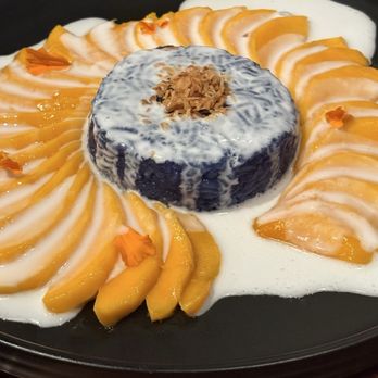 Hanuman Thai Eatery - Mango sticky rice with fresh mangos covers with a heavenly coconut sauce. - Thai Near Me - Costa Mesa, California Hanuman Thai Eatery - Mango sticky rice with fresh mangos covers with a heavenly coconut sauce. - Thai Near Me - Costa Mesa, California