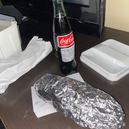 a bottle of coke and a sandwich a bottle of coke and a sandwich
