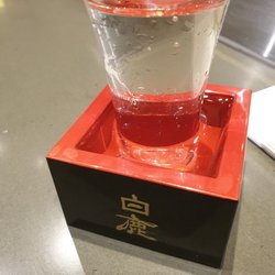 Oi Sushi - 8 dollar sake. You drink the drink in the cup and then the box ! Worth it, very lovely to have with dinner.