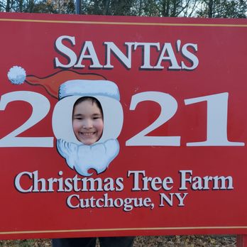 Santas Christmas Tree Farm - My not-so-little one at one of their photo props! - Christmas Trees Near Me - Cutchogue, New York