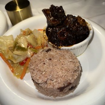 Status Hollywood - Oxtail plate with cabbage and rice & beans - Seafood Near Me - Los Angeles, California Status Hollywood - Oxtail plate with cabbage and rice & beans - Seafood Near Me - Los Angeles, California