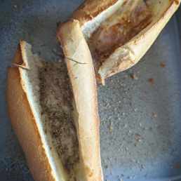 Tiny meatballs, teaspoon of red sauce and a dusting of cheese on dry stale bread. Tiny meatballs, teaspoon of red sauce and a dusting of cheese on dry stale bread.